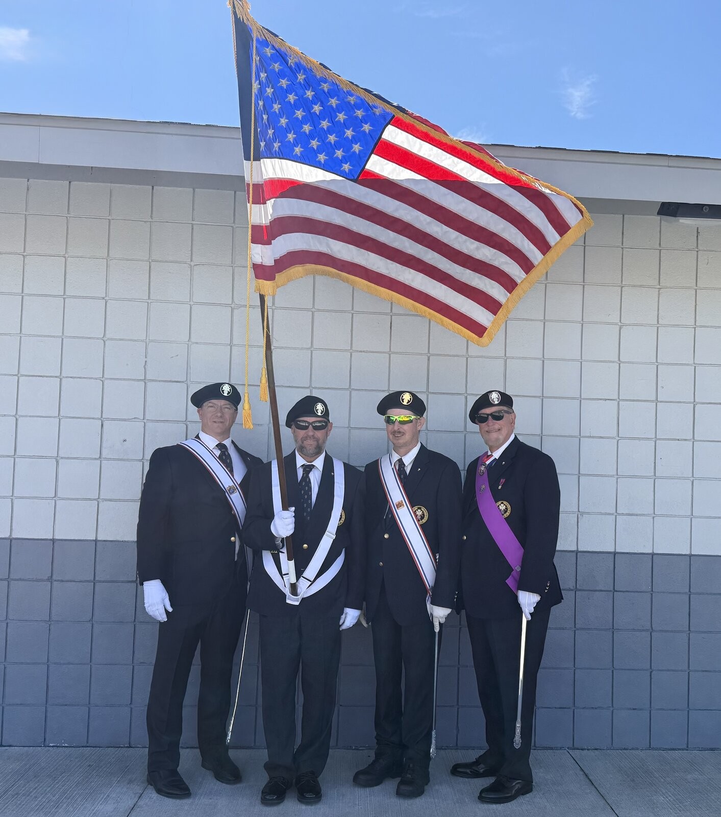 Fourth Degree Color Corps with the American flag at East China Stadium
