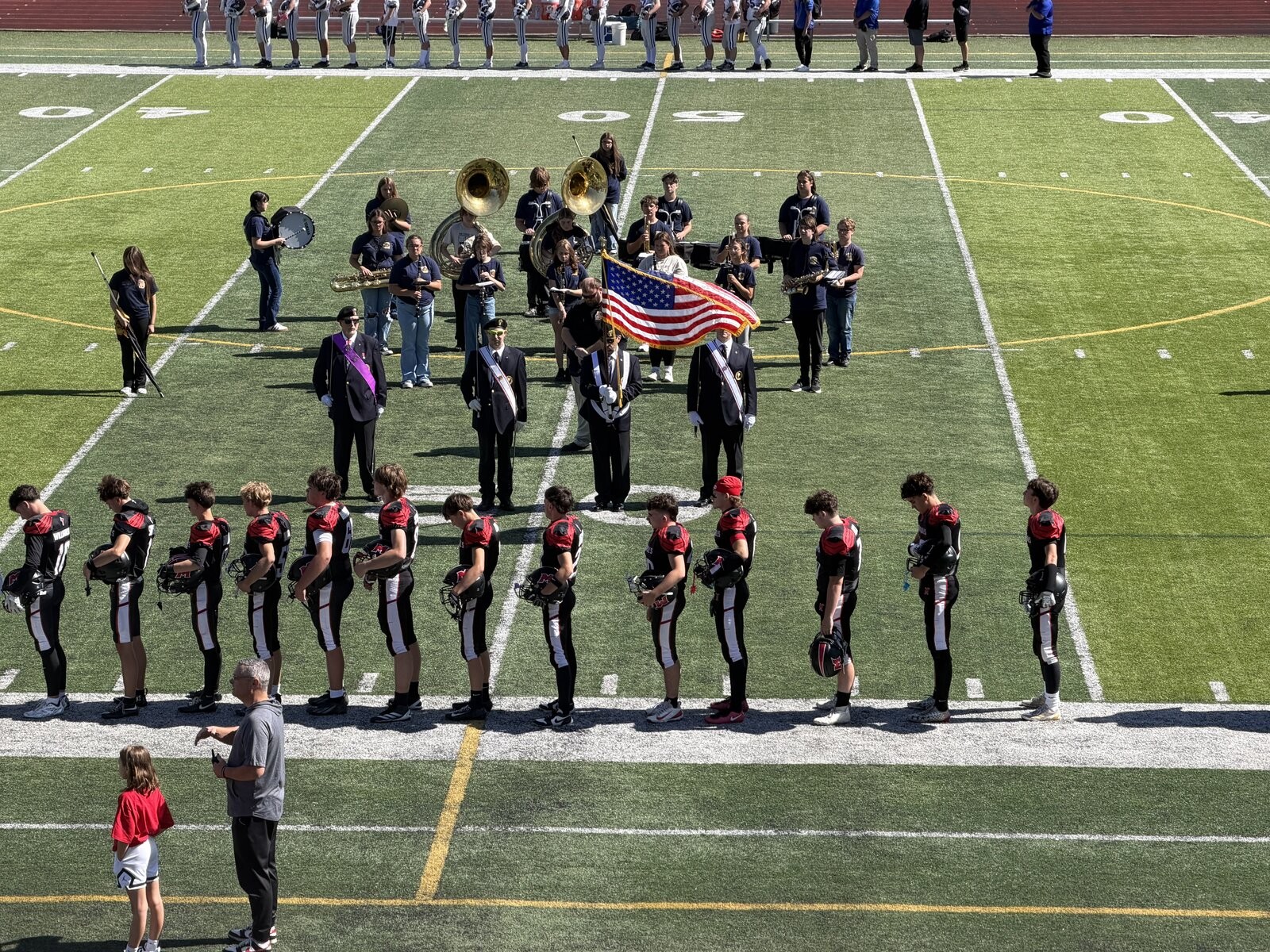 Fourth Degree Color Corps presenting the Colors with the band and football team at the Cardinal Mooney Homecoming game