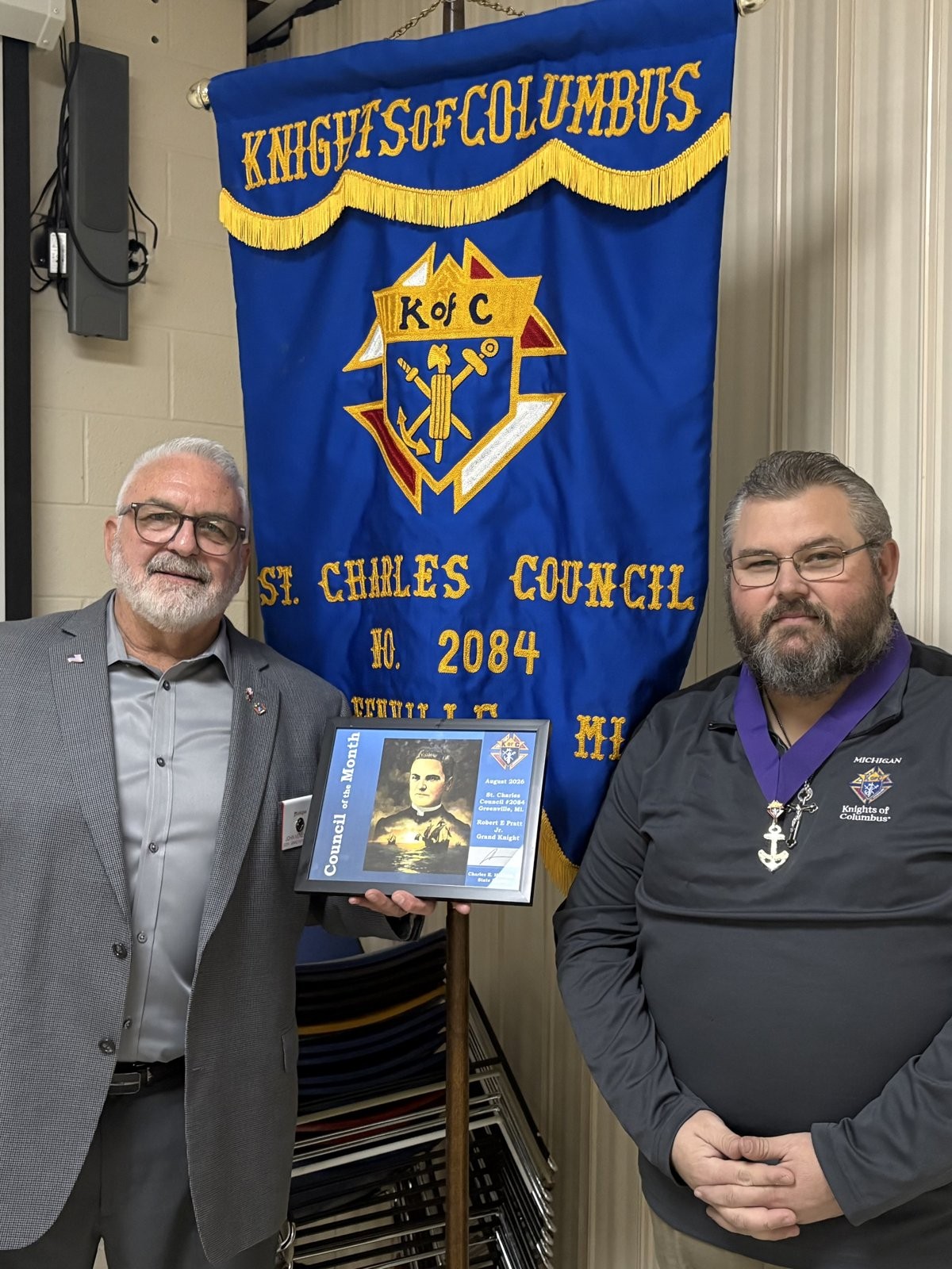 John Veneklase presents the Council of the Month award to Grand Knight Robert Pratt Jr.
