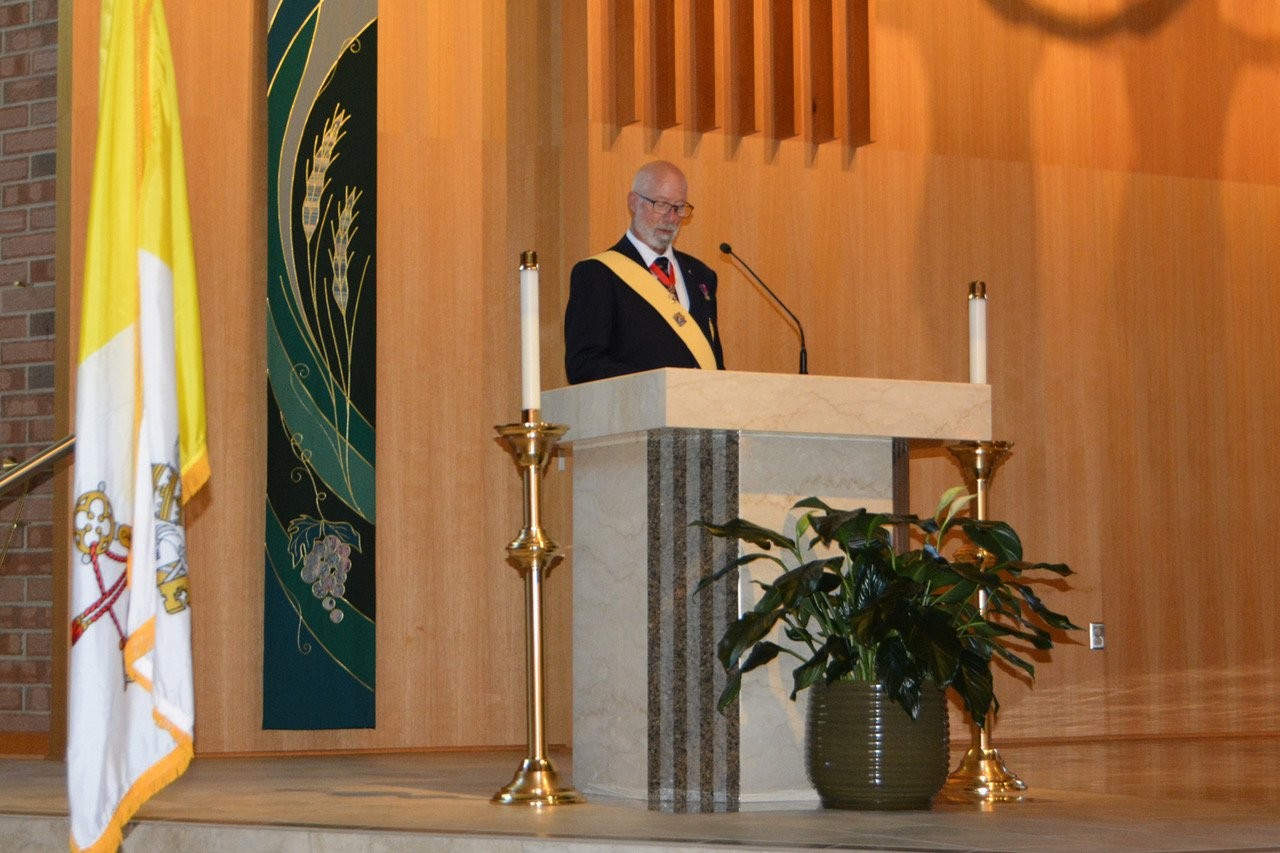 Sir Knight speaking at the ambo during the exemplification ceremony