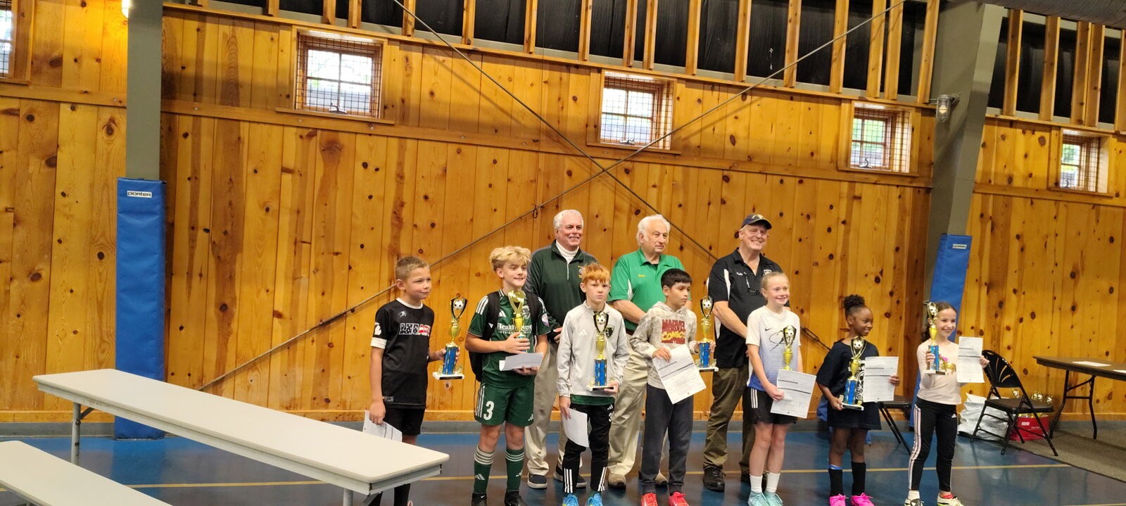 Lansing South Soccer Challenge players with their trophies and certificates