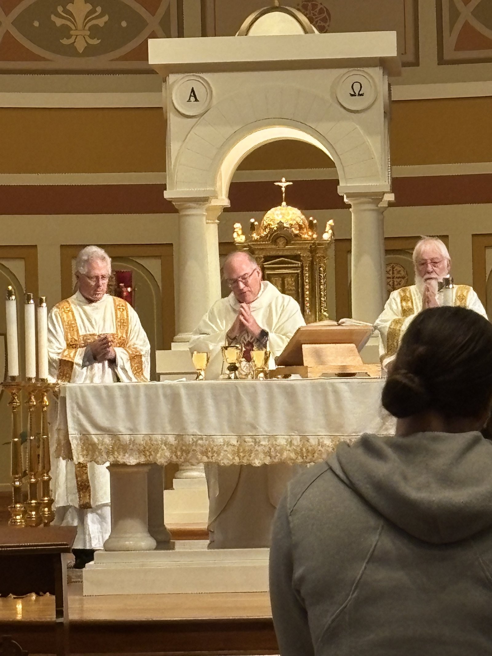Priest and deacons at the altar during the Pro-life Mass